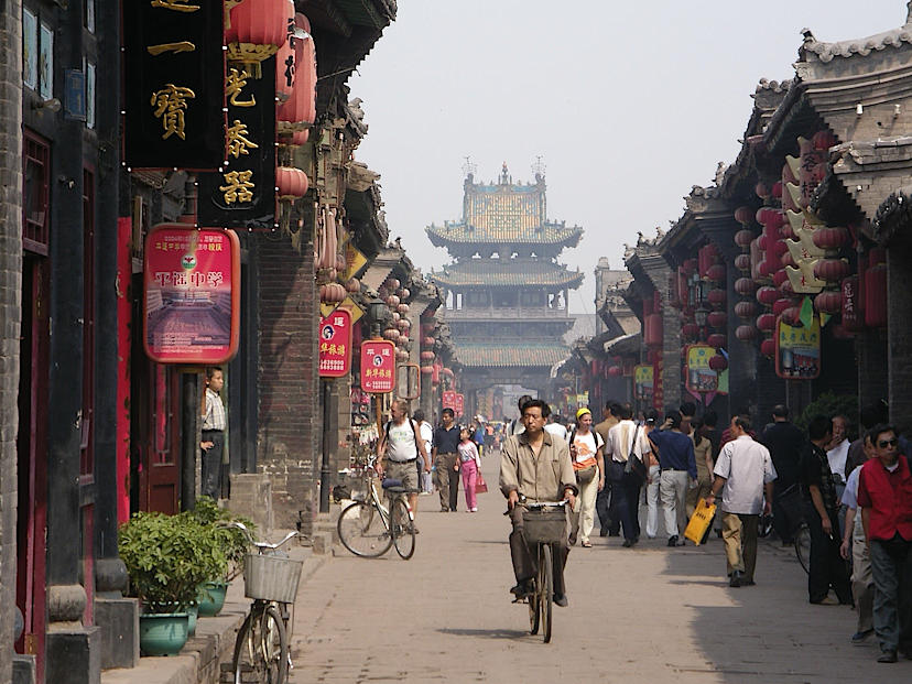 City of Pingyao Buddhist Temple with man on bike