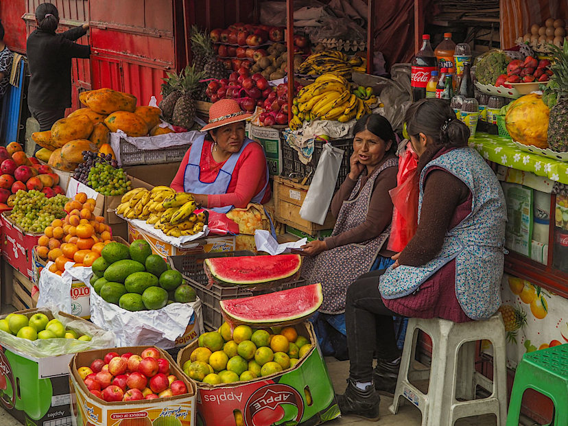 Women in market selling fruit